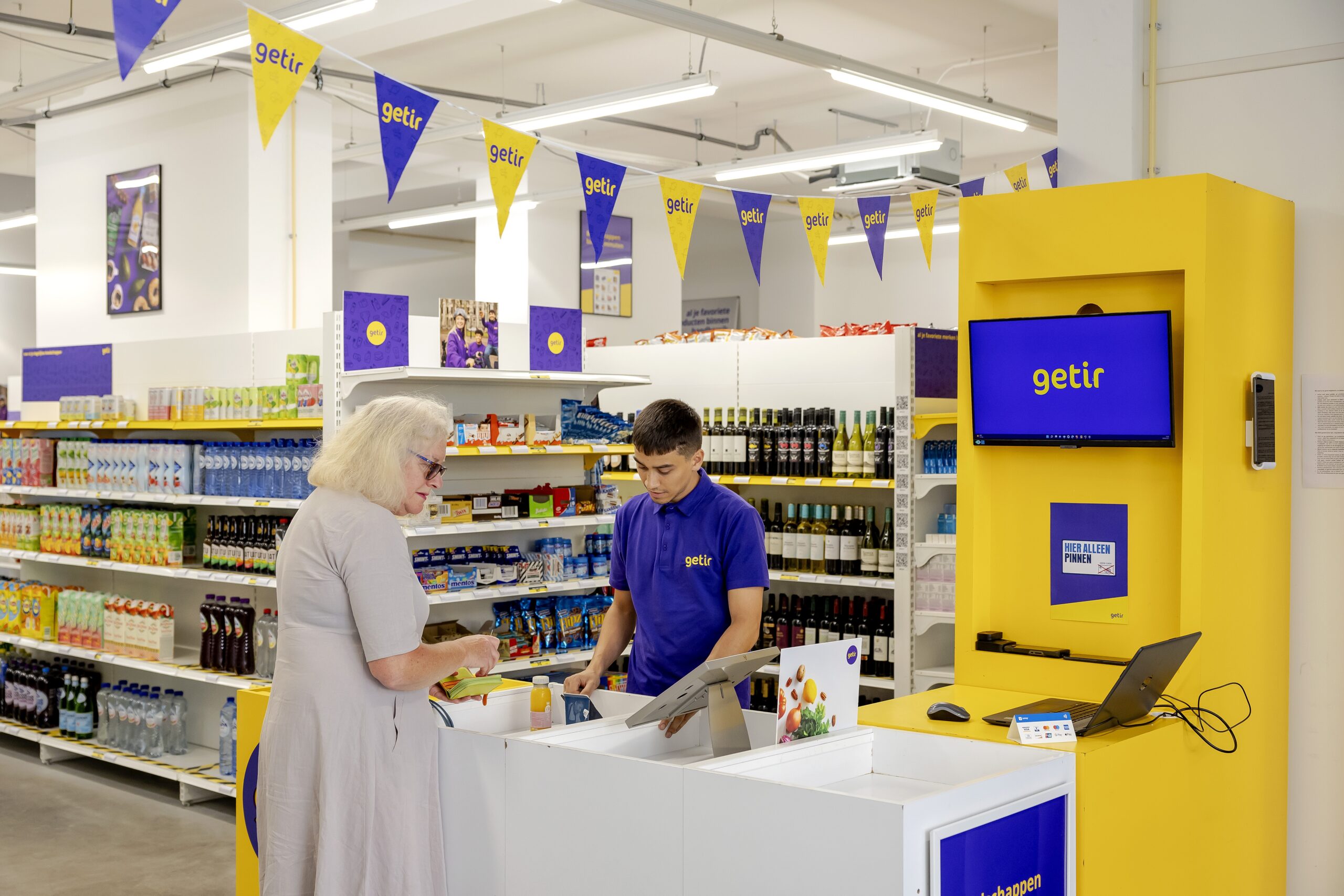 Een klant rekent af in de supermarkt, hier bij het filiaal in De Pijp. Foto: ANP